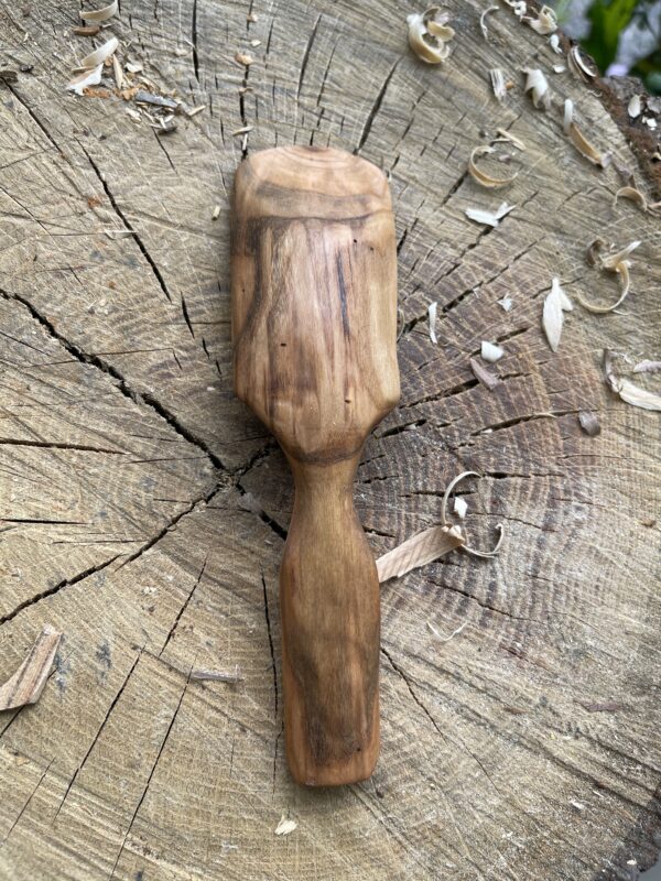 Peach scoop hand-carved