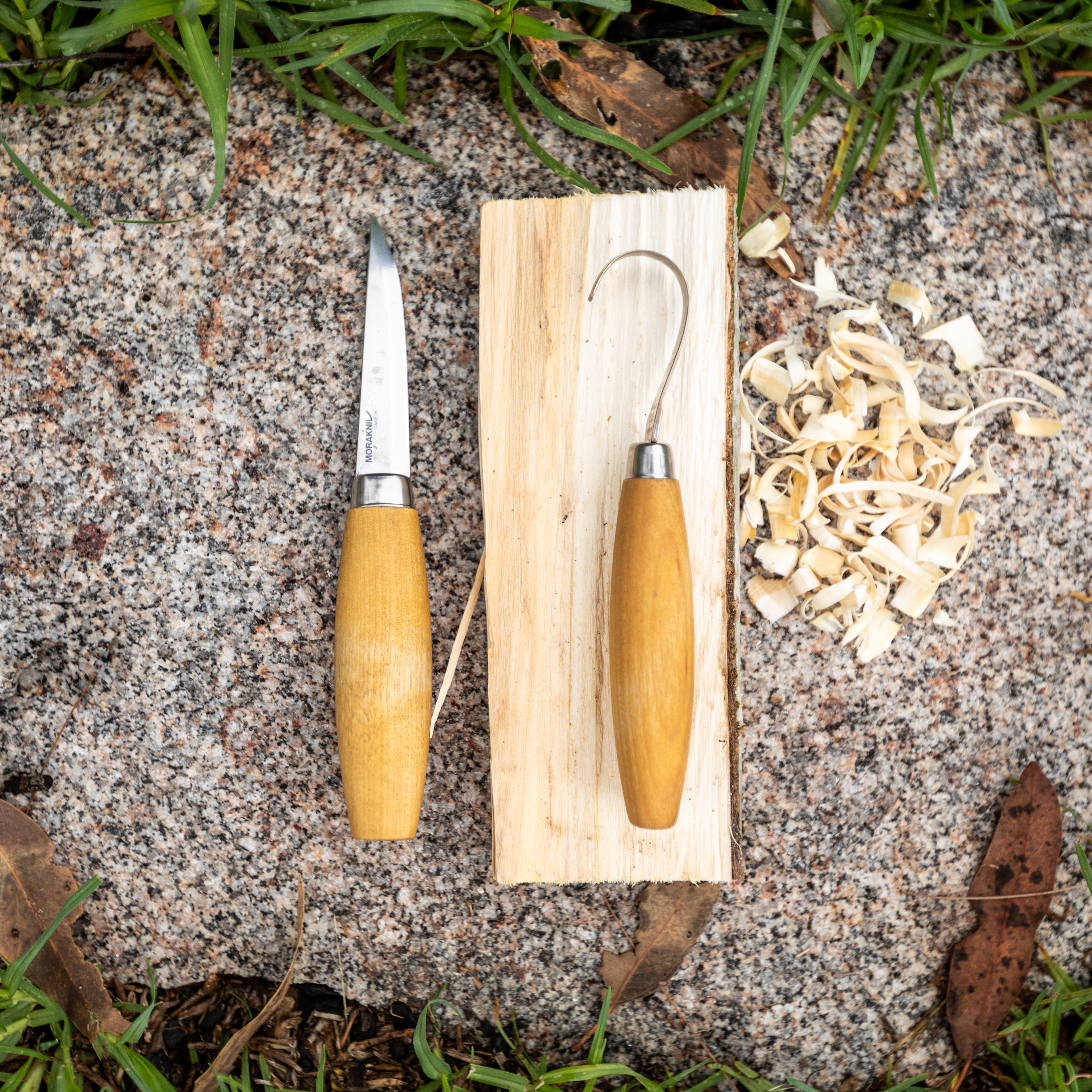 Carving and whittling knives Morakniv brand. A straight knife on the left ad hook knife on the right.